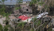 Wreckage showing the tail section of the Air India Boeing 787-8 is pictured in a residential area near the airport in Ahmedabad on June 14, 2025. (Photo by Dibyangshu Sarkar / AFP)