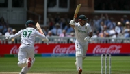 South Africa's wicket keeper Kyle Verreynne (L) and David Bedingham (R) celebrate victory, at Lord's cricket ground, in London, on June 14, 2025. (Photo by Glyn Kirk / AFP) 