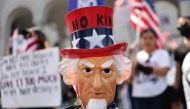 Protesters rally near City Hall during an anti-Trump 