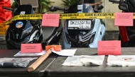 Evidence seized from the suspects allegedly involved in the murder of an Australian man at a Bali villa are seen on display during a press conference at the Badung district police station in Badung regency on Indonesia's resort island of Bali on June 18, 2025. Photo by Sonny Tumbelaka / AFP