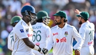 Bangladesh's captain Najmul Hossain Shanto (R) shakes hands with Sri Lanka's Angelo Mathews after the latter's dismissal during the fifth and final day of the first Test cricket match between Sri Lanka and Bangladesh at the Galle International Cricket Stadium in Galle on June 21, 2025. (Photo by Ishara S. KODIKARA / AFP)