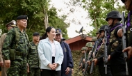 This handout photo from the Royal Thai Government taken and released on June 20, 2025 shows Thailand's Prime Minister Paetongtarn Shinawatra (C) speaking to troops next to Royal Thai Army Lieutenant General Boonsin Padklang (L) during a visit to Morakot Operations Base in Ubon Ratchathani province. Photo by Handout / ROYAL THAI GOVERNMENT / AFP.