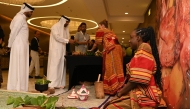 Attendees inspect some of the items on display at the event.