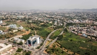 This aerial view shows urban farms in Abuja Central Business District, in Nigeria, on May 23, 2025. (Photo by Olympia De Maismont / AFP)