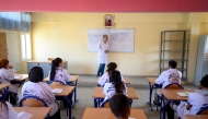 Students attend an Arabic language class at the