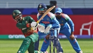 FILE PHOTO: Bangladesh's Towhid Hridoy (L) plays a shot as India's wicketkeeper KL Rahul (C) watches during the ICC Champions Trophy one-day international (ODI) cricket match between Bangladesh and India at the Dubai International Stadium in Dubai on February 20, 2025. (Photo by Fadel Senna / AFP)