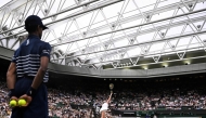 Russia's Anastasia Pavlyuchenkova serves to Britain's Sonay Kartal during their women's singles fourth round tennis match on the seventh day of the 2025 Wimbledon Championships at The All England Lawn Tennis and Croquet Club in Wimbledon, southwest London, on July 6, 2025. (Photo by Kirill KUDRYAVTSEV / AFP)