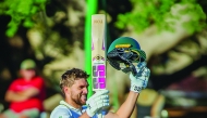 Wiaan Mulder raises the bat after reaching his triple century.