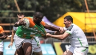 Mehdi Slamani (R) of Algeria vies with Boris Diomande of Cote d'Ivoire during a match at the Rugby Africa Cup Championship 2025 in Kampala, Uganda, July 8, 2025. (Photo by Hajarah Nalwadda/Xinhua)
 