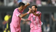Inter Miami's Argentine forward #10 Lionel Messi (R) celebrates with Inter Miami's Uruguayan forward #09 Luis Suarez after scoring his team's second goal during the Major League Soccer (MLS) regular season soccer match between Inter Miami CF and Nashville SC at Chase Stadium in Fort Lauderdale, Florida on July 12, 2025. (Photo by CHANDAN KHANNA / AFP) 