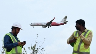 An Air India Express aircraft prepares to land at Kempegowda International Airport in Bengaluru on September 4, 2024. (Photo by Idrees MOHAMMED / AFP)