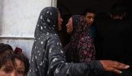 Palestinian women mourn outside the Al-Shifa hospital in Gaza City on July 31, 2025, where bodies of people killed a day earlier while waiting for aid were brought. (Photo by Bashar TALEB / AFP)
