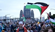 Demonstrators march across the Sydney Harbour Bridge during a pro-Palestinian rally against Israel's actions and the ongoing food shortages in the Gaza Strip, in Sydney on August 3, 2025. Photo by Saeed Khan/ AFP