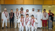 President of the Qatar Boxing and Wrestling Federation Sheikh Fahad bin Khalid Al Thani poses with members of the Qatar youth boxing team and federation officials upon their return from the Asian Youth Championship held in Bangkok.
