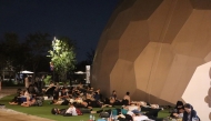 Visitors sleep outside one of the venues overnight after a power outage abruptly shut down the Osaka Metro line linking the city to the 2025 Osaka Expo site, in Osaka early on August 14, 2025. Photo by JIJI Press / AFP