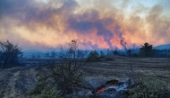 Plumes of black smoke rise from the forest around Manavgat, 75 km (45 miles) east of the resort city of Antalya, Turkey, July 28, 2021. REUTERS/Kaan Soyturk