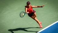Great Britain's Emma Raducanu plays a forehand return to Japan's Ena Shibahara during their women's singles first round tennis match on day one of the US Open tennis tournament at the USTA Billie Jean King National Tennis Center in New York City, on August 24, 2025. (Photo by Kena Betancur / AFP)
