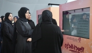 Minister of Education and Higher Education H E Lolwah bint Rashid bin Mohammed Al-Khater listens to officials during the Ministry's 'Back to School' event at QNCC yesterday. 