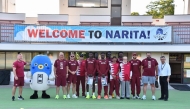 Team Qatar's athletes and officials pose for a group photo.