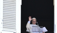 Pope Leo XIV salutes as he addresses the crowd from the window of the apostolic palace overlooking St.Peter's square on August 31, 2025. (Photo by Alberto Pizzoli / AFP)