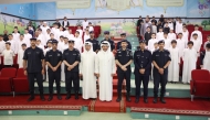 MoI officials with students at Ahmed Mansour Primary School for Boys yesterday. 