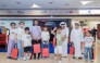 Children with gifts at the Back-to-School event by Qatar Rail.