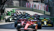 Ferrari's Monegasque driver Charles Leclerc leads at the start of the Formula One Monaco Grand Prix on May 26, 2024 at the Circuit de Monaco. (Photo by ANDREJ ISAKOVIC / AFP)

