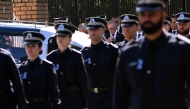 Australia's Prime Minister Anthony Albanese (C) pays his respects as the coffin of police officer Senior Constable Vadim de Waart-Hottart leaves the Victoria Police Academy chapel. (Photo by William West / AFP)