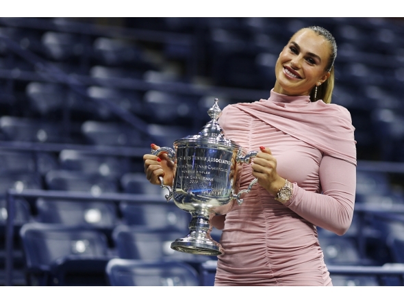 Aryna Sabalenka poses with the championship trophy after defeating Amanda Anisimova of the United States in the Queens borough of New York City. Sarah Stier/Getty Images/AFP