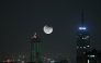 This double-exposure photo shows a view of lunar eclipse in the sky over Nairobi, Kenya, on September 7, 2025 . (Xinhua/Yang Guang)
