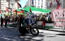 Pro-Palestinians protesters demonstrate as a cyclist competes during the 18th stage of the Vuelta a Espana, yesterday. 