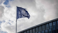 A NATO flag flies at the NATO headquarters in Brussels on September 12, 2025. (Photo by Simon Wohlfahrt / AFP)