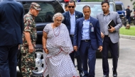 Newly-elected Prime Minister of Nepal痴 interim government Sushila Karki (2L) arrives at the Civil Service Hospital to visit victims injured during clashes with security personnel, in Kathmandu on September 13, 2025. (Photo by Prabin RANABHAT / AFP)
