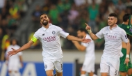 Qatar's Hassan Al Haydos celebrates after scoring the equaliser.