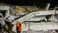 Rescue personnel inspect the site after a building collapsed at an Islamic boarding school in Sidoarjo, East Java province on September 29, 2025, injuring a number of students and trapping several others under the rubble. Photo by Juni KRISWANTO / AFP