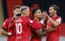 Al Rayyan's Roger Guedes (centre) celebrates with teammates.