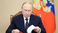 In this pool photograph distributed by the Russian state agency Sputnik, Russia's President Vladimir Putin holds an operational meeting via videoconference with permanent members of the Russian Security Council in Moscow on October 1, 2025. (Photo by Aleksey Babushkin / POOL / AFP)
