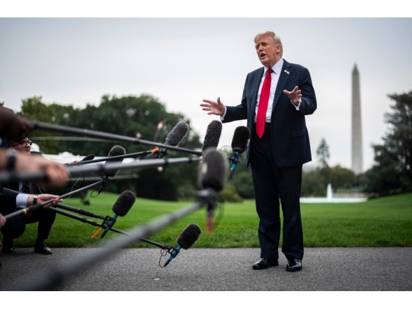 President Donald Trump speaks to reporters at the White House. (Photo by Jabin Botsford/The Washington Post)
