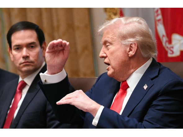 US President Donald Trump speaks, as Secretary of State Marco Rubio looks on, during a cabinet meeting in the Cabinet Room of the White House in Washington, DC, on October 9, 2025. (Photo by Jim Watson / AFP)