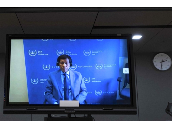 File: Former Philippine President Rodrigo Duterte is seen on a screen in the courtroom during his first appearance before the International Criminal Court (ICC) in The Hague on March 14, 2025. (Photo by Peter Dejong / POOL / AFP)

