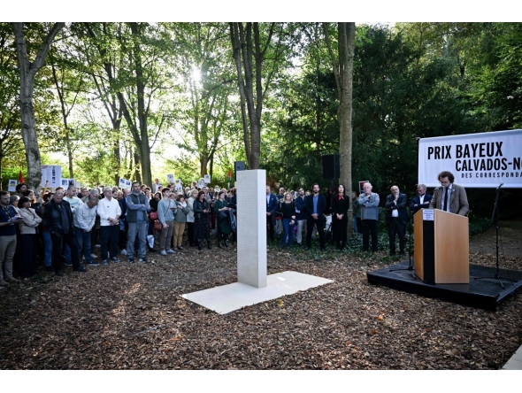 French General Director of RSF Thibault Bruttin addresses the audience during a ceremony next to the 2024-2025 memorial paying tribute to the 73 journalists killed around the world while doing their job during the past year, as part of the 2025 edition of the “Prix Bayeux Calvados-Normandie of the war correspondants”, in Bayeux, northwestern France, on October 9, 2025. (Photo by Lou BENOIST / AFP)