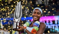USA's Coco Gauff poses with her trophy after winning against USA's Jessica Pegula during an award ceremony for their women's singles at the Wuhan Open tennis tournament in Wuhan, Central China's Hubei province on October 12, 2025. (Photo by Adek Berry / AFP)