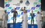Champion Jake Franklin (top centre), Mohammed Adel Al Mutawa and Anas Boukabache pose for a photo with officials during the presentation ceremony.