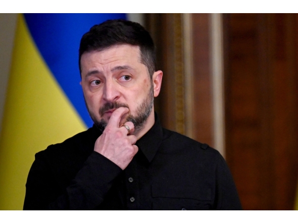 Ukraine's President Volodymyr Zelensky reacts as he holds a joint press-conference following talks with High Representative of the European Union for Foreign Affairs and Security Policy in Kyiv on October 13, 2025, amid the Russian invasion in Ukraine.(Photo by Sergei Supinsky / AFP)