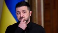 Ukraine's President Volodymyr Zelensky reacts as he holds a joint press-conference following talks with High Representative of the European Union for Foreign Affairs and Security Policy in Kyiv on October 13, 2025, amid the Russian invasion in Ukraine.(Photo by Sergei Supinsky / AFP)