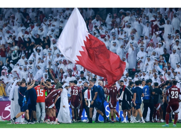 Qatari players celebrate after winning the FIFA World Cup 2026 Asian qualifier football match against the UAE at Jassim Bin Hamad Stadium in Doha yesterday. (AFP)