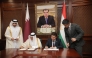 Minister of State for Foreign Trade Affairs, H E Dr. Ahmed bin Mohammed Al-Sayed, and Minister of Economic Development and Trade of the Republic of Tajikistan, H E Zavqi Zavqizoda, during the signing ceremony.