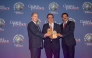 A Commercial Bank official receiving the awards during the event.
