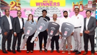Safari Hypermarket officials with the winners of the promotion.