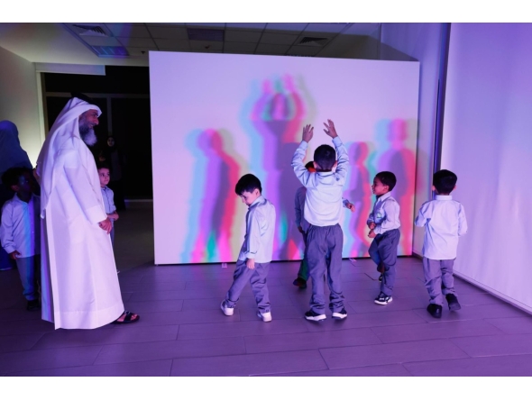 Children enjoy a show at the Light Exhibition.